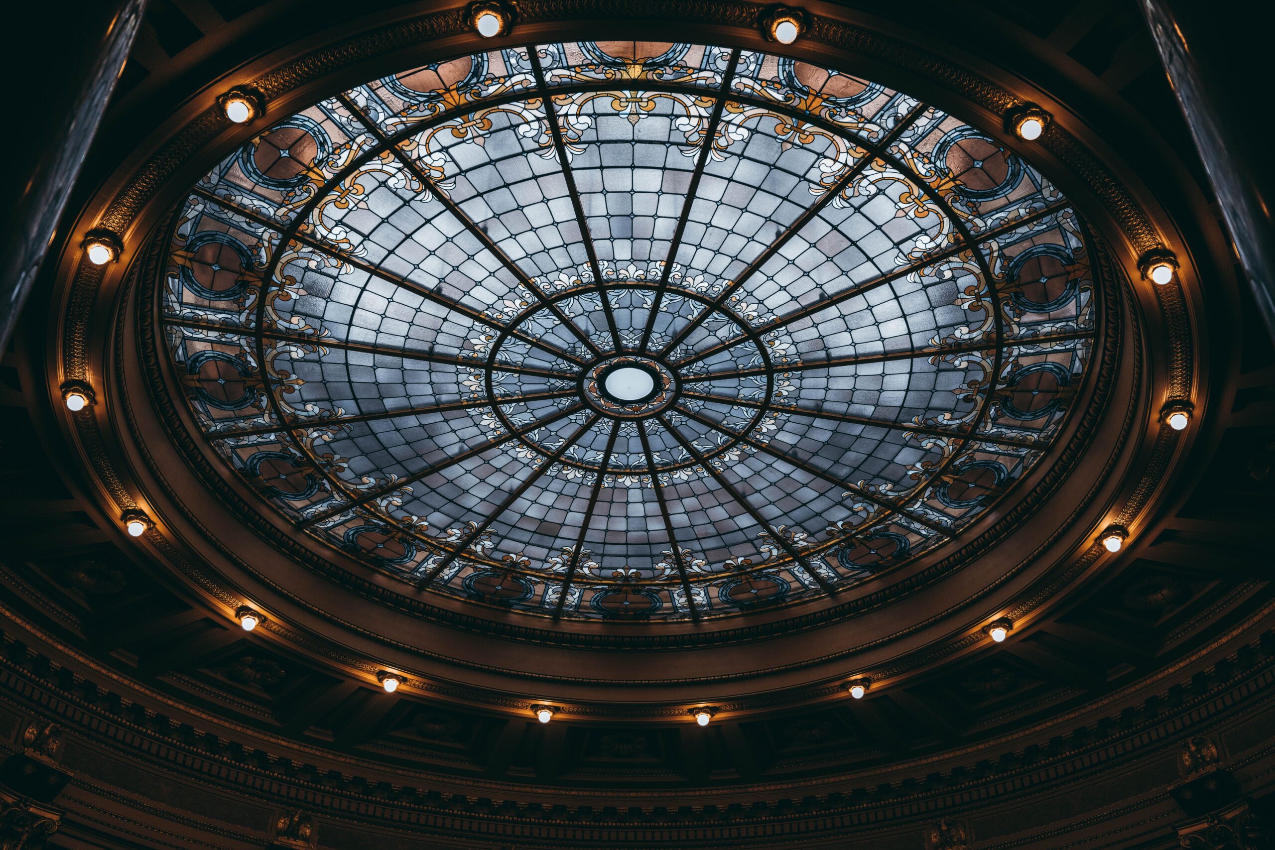 Elegant baroque glass dome illuminated in Madison, Wisconsin's State Capitol building.